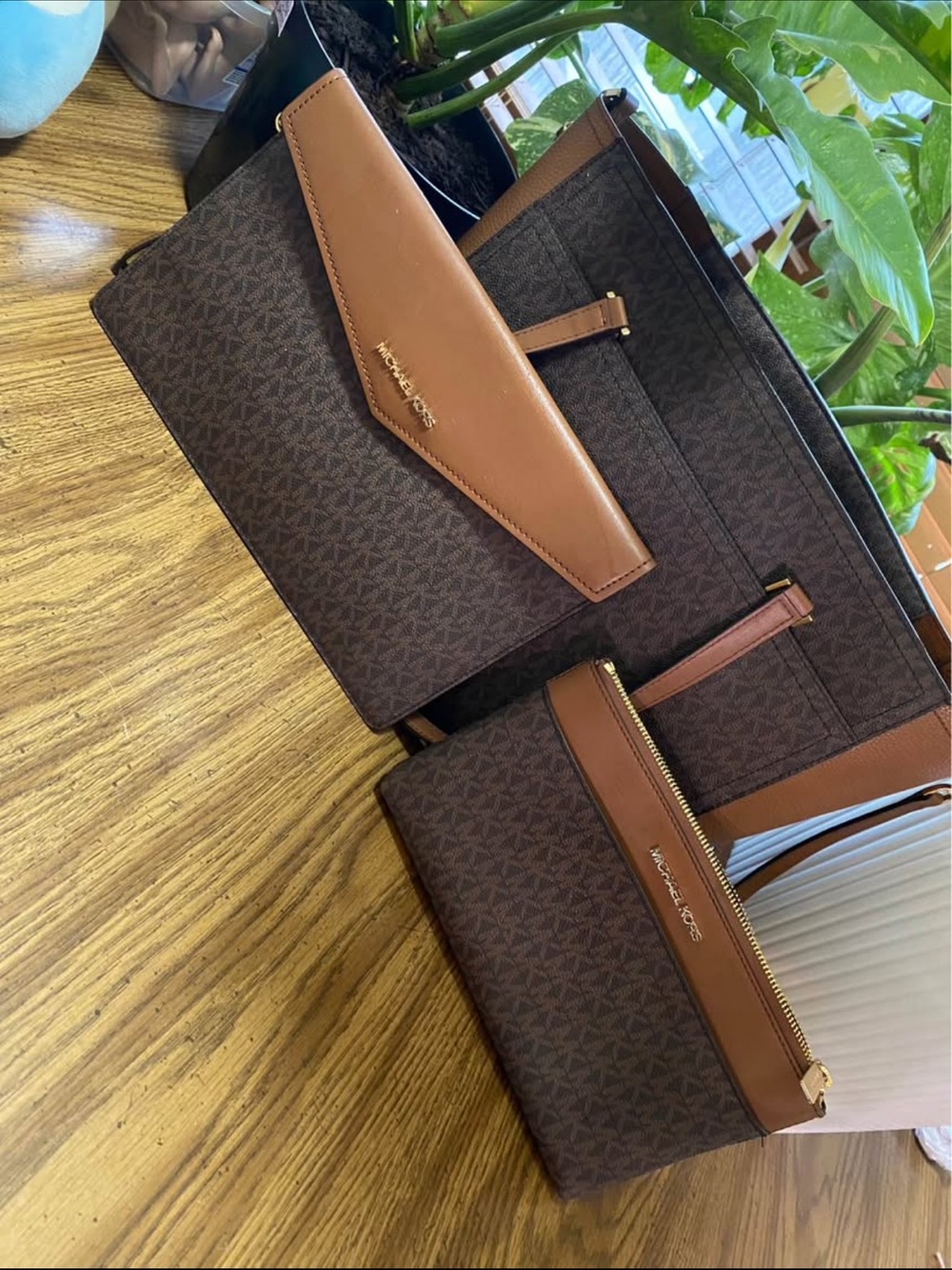 Michael Kors woman’s Brown Signature Monogram bag and Pouch and wallet set